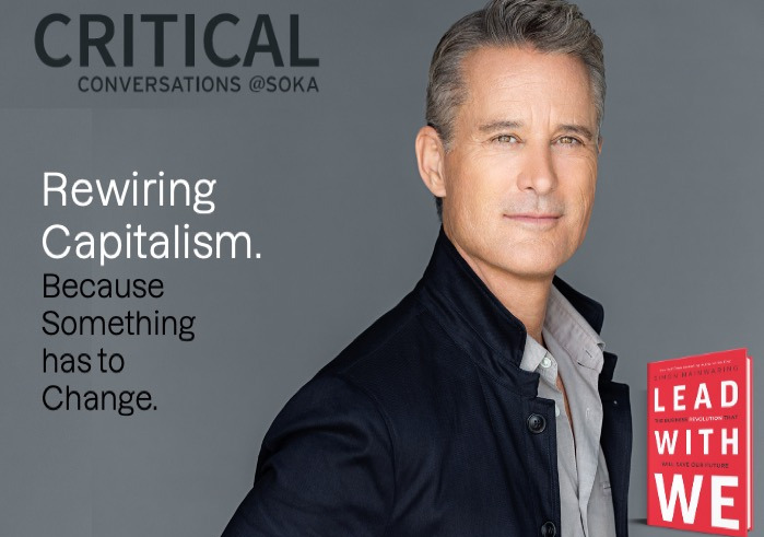 Man in black jacket with red book titled Lead With We